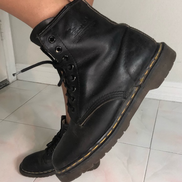 black boots with yellow stitching